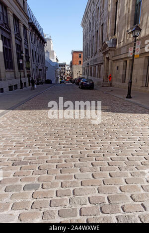 View down a cobblestone street in Old Montreal, Quebec, Canada Stock Photo