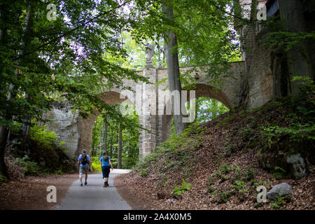 Hruba Skala Castle, couple of tourists on the trail Stock Photo