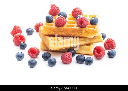 Waffles with blueberries and raspberries isolated on white background. Stock Photo