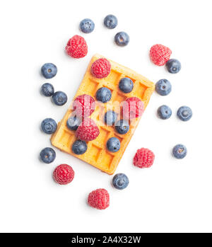 Waffles with blueberries and raspberries isolated on white background. Stock Photo