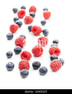 Blueberries and raspberries. Tasty mix of berries isolated on white background. Stock Photo