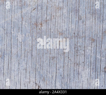 Close-up of a weathered and dirty wooden wall, flooring or wood panelling with light blue hue. High resolution full frame background. Stock Photo