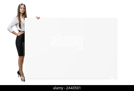 Businesswoman in official clothing is holding side of blank banner isolated on white background Stock Photo