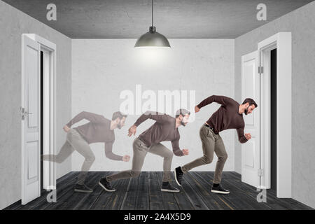 A young bearded man runs fast from one door into another with his translucent shade following after him. Stock Photo