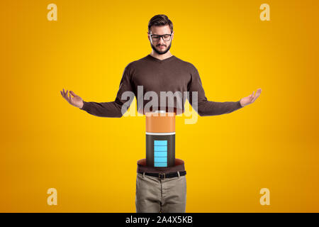 Front view of young hadsome man doing meditation gesture, his body cut at waist and upperbody lifted in air, with big battery between the two parts. Stock Photo