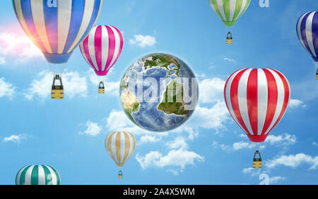 An Earth globe on cloudy sky background surrounded by many large hot air balloons. Stock Photo