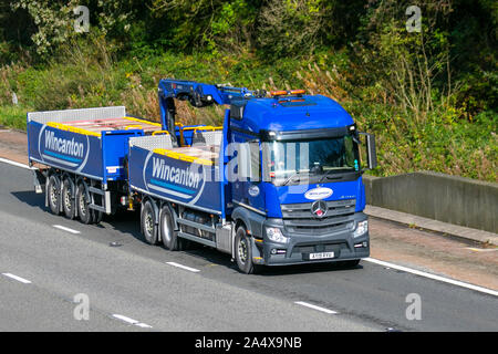 Wincanton construction materials;  Motorway heavy bulk Haulage delivery trucks, haulage, lorry, transportation, truck, special cargo, Mercedes Benz Astros vehicle, delivery, transport industry, construction industry freight on the M6 at Lancaster, Stock Photo
