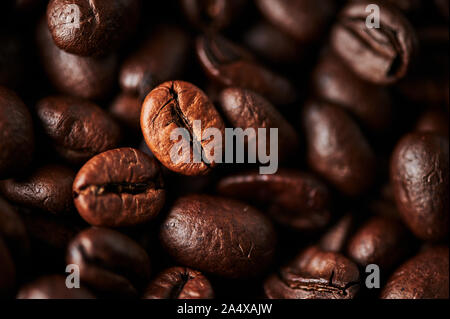 Close up of roasted coffee beans for background, texture and design. Selective focus. Stock Photo