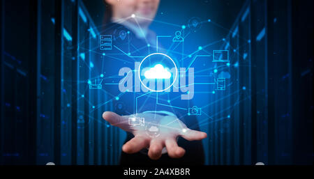 Man holding hologram projection displaying cloud technology symbols Stock Photo