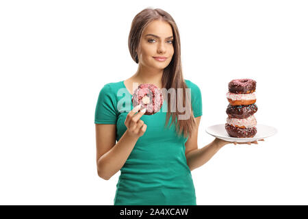 Beautiful young lady with a plate of chocolate donuts and a donut in her hand isolated on white background Stock Photo