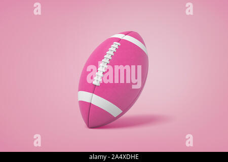 3d rendering of magenta American football ball with white stripes stands on a pink background. Stock Photo