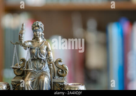 Statue of justice in front of library, law concept. Stock Photo