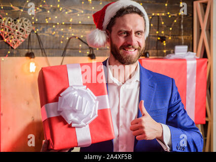 Secret santa office tradition. Man formal suit hold gift box. Christmas gift  from colleague. Tradition giving gifts. Celebrate christmas corporate  party. Businessman excited face hold gift box Stock Photo - Alamy