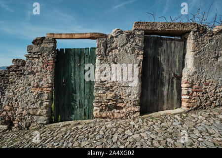 Borgio Verezzi, Italy - December 8 2018: Two doors on a stone wall  Stock Photo