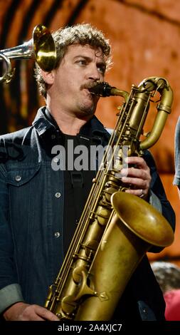 Baritone saxophone player with Lukas Nelson, band Promise of the Real, performing country rock music live, at Farm Aid, in East Troy, Wisconsin, USA Stock Photo