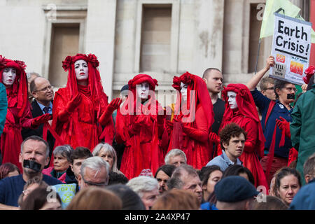 London, UK. 16 October, 2019. Extinction Rebellion’s Red Brigade joins the People’s Assembly in Trafalgar Square in protest against the use by the Metropolitan Police of Section 14 of the Public Order Act 1986 to prohibit entirely Extinction Rebellion Autumn Uprising protests throughout the capital. Credit: Mark Kerrison/Alamy Live News Stock Photo