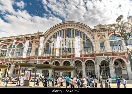 People waiting for buses in front of Torino Porta Nuova railway station ,Turin's main and busiest  railway station ,Turin ,Italy Stock Photo