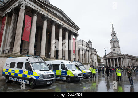 London, UK. 16 October, 2019. Police officers and vehicles stand in Trafalgar Square following a Metropolitan Police prohibition on Extinction Rebellion Autumn Uprising protests throughout London under Section 14 of the Public Order Act 1986. Credit: Mark Kerrison/Alamy Live News Stock Photo