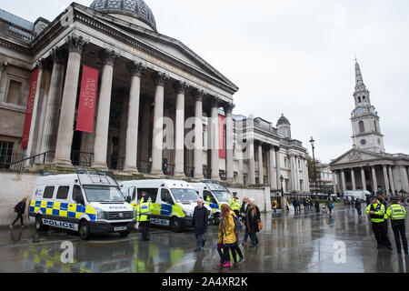 London, UK. 16 October, 2019. Police officers and vehicles stand in Trafalgar Square following a Metropolitan Police prohibition on Extinction Rebellion Autumn Uprising protests throughout London under Section 14 of the Public Order Act 1986. Credit: Mark Kerrison/Alamy Live News Stock Photo