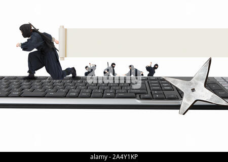 Keyboard and ninja Stock Photo