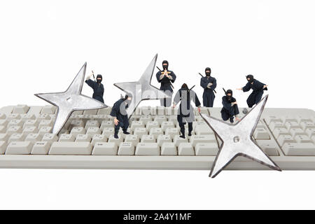 Keyboard and ninja Stock Photo