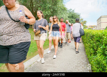 People line up in the back ground to cast their vote in parliamentary ...