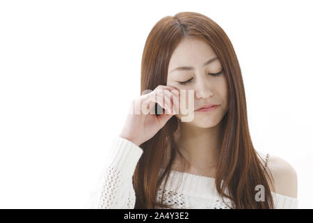 sad woman crying on white background Stock Photo