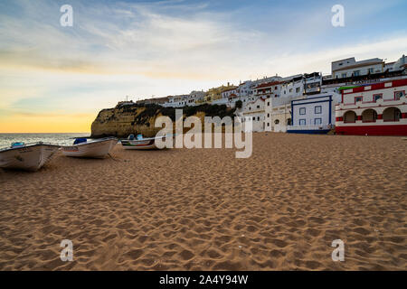 View of the beautiful Praia de Carvoeiro at sunset, one of the best sandy beaches in Algarve. Carvoeiro, Portugal, April 2019 Stock Photo