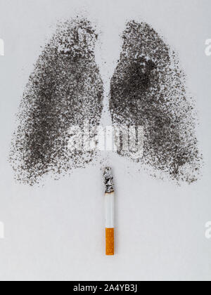 Shape of lungs with charcoal powder and cigarette on white background Stock Photo