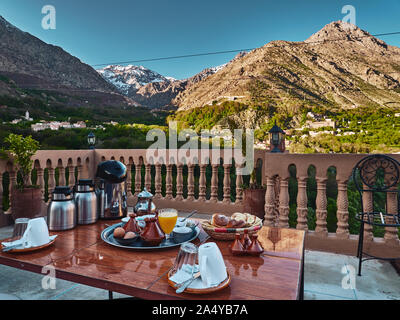 Detail of traditional moroccan breakfast setting with mountain view in the background in Imlil, Morocco, High Atlas mountains Stock Photo