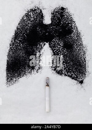 Shape of lungs with charcoal powder and cigarette on white background Stock Photo