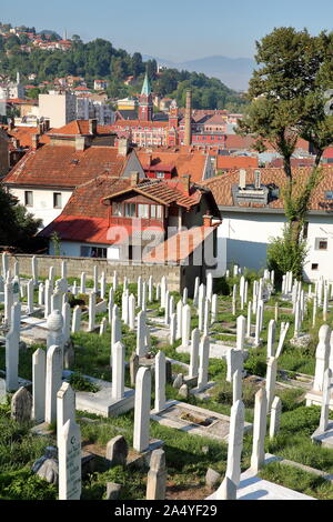 SARAJEVO, BOSNIA AND HERZEGOVINA - SEPTEMBER 15, 2019: Alifakovac cemetery, with traditional wooden houses Stock Photo