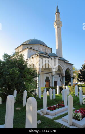 SARAJEVO, BOSNIA AND HERZEGOVINA - SEPTEMBER 20, 2019: Ali Pasha's Mosque, with gravestones in the foreground Stock Photo