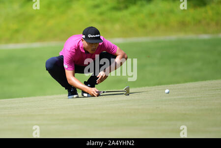 Sanya, China's Hainan Province. 17th Oct, 2019. Bai Zhengkai of China observes during the first round match at the European Challenge Golf Tour 2019 Hainan Open in Sanya, south China's Hainan Province, on Oct. 17, 2019. Credit: Guo Cheng/Xinhua/Alamy Live News Stock Photo