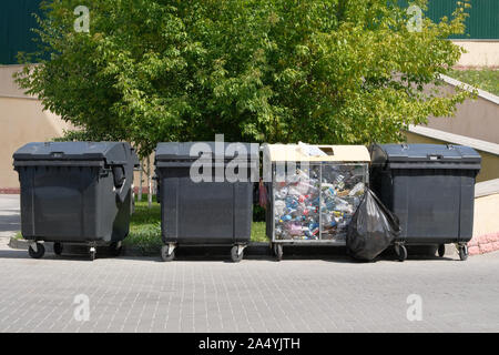 Garbage is pile lots dump. Garbage waste lots junk dump. Dustbins being full with garbage. Stock Photo