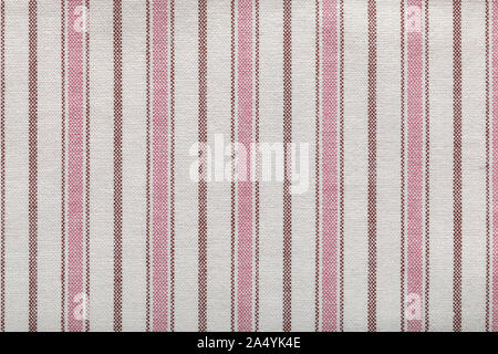 Colored striped coarse linen fabric texture closeup as background. a rustic canvas fabric texture. Stock Photo