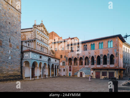 Pistoia, Tuscany, Italy main square Piazza Duomo with beautiful cathedral front and old gothic bishops palace under clear blue sky Stock Photo