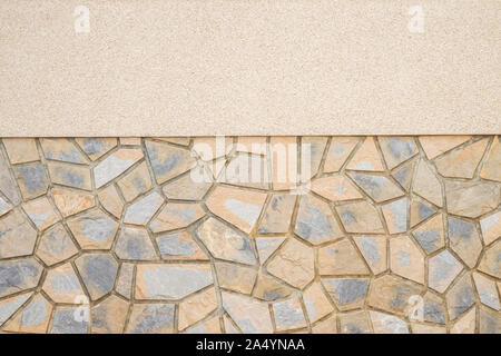 Two different textures wall background. New plastered and masonry wall of stones with irregular pattern texture background Stock Photo
