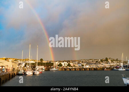 Penzance, Cornwall, UK. 17th October 2019. UK Weather. Changeable weather for sunrise this morning, with sharp showers and rainbows just after sunrise in Penzance. Credit Simon Maycock / Alamy Live News. Stock Photo