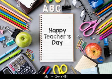 Happy teacher's day and Education or back to school Concept. Top view of Colorful school supplies with books, color pencils, calculator, pen cutter cl Stock Photo
