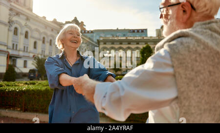 Happy together. Beautiful senior couple dancing and laughing outdoors. Family. Love. Happy moments Stock Photo