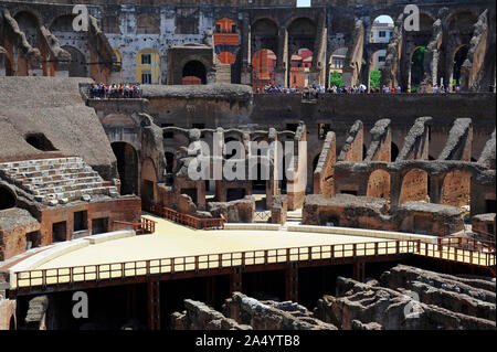 Tourists flocking at Colosseum, one of the most visited landmark in Rome also known as the Flavian Amphitheatre, inside views, Rome, Italy Stock Photo