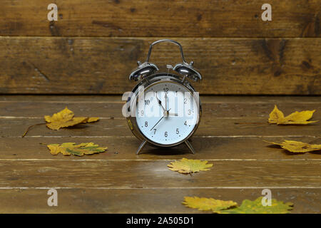 Autumn still life with an old alarm clock Stock Photo