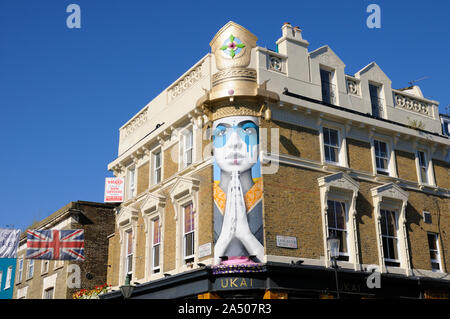 Mural street art 'Lady Kinoko' by Fin DAC above the Japanese restaurant UKAI, Portobello Road and Lancaster Road, Notting Hill, London, England, UK Stock Photo