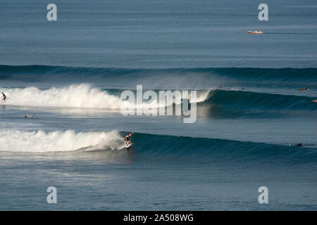 Surfing at Balangan beach in Bali, Indonesia