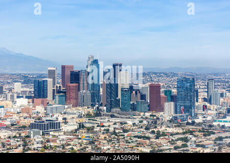 Aerial view of the Los Angeles skyline at sunset with pink sky and ...