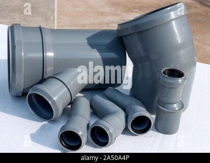 Composition from plastic sewer pipes, isolated on a white Stock Photo