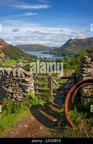 Looking towards Ullswater from Birkhouse Moor path drystone wall gate summer Glenridding Lake District National Park Cumbria England UK Great Britain Stock Photo