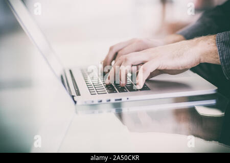 Work on a laptop - as always, the programmer pretends to work Stock Photo