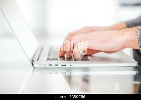 Work on a laptop - as always, the programmer pretends to work Stock Photo